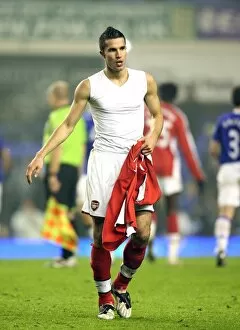 Images Dated 28th January 2009: Robin van Persie goes to throw his shirt to the Arsenal
