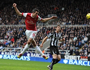 Robin van Persie heads past Newcastle goalkeeper Steve Harper to score the 4th Arsenal Robin van Persie heads past Newcastle goalkeeper Steve Harper to score the 4th Arsenal
