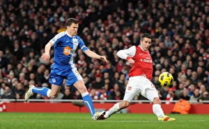 Robin van Persie scores his and Arsenal's 2nd goal under pressure from Gary Caldwell Robin van Persie scores his and Arsenal's 2nd goal under pressure from Gary Caldwell