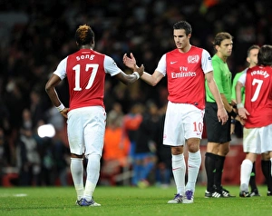Robin van Persie shakes hands with Alex Song (Arsenal) at the end of the match Robin van Persie shakes hands with Alex Song (Arsenal) at the end of the match