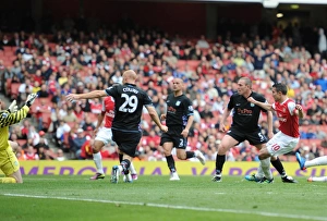 Robin van Persie shoots past Aston Villa goalkeeper Brad Friedel to score the Arsenal goal Robin van Persie shoots past Aston Villa goalkeeper Brad Friedel to score the Arsenal goal