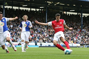 Robin van Persie shoots past Blackburn goalkeeper Brad Friedel to score the Arsenal goal Robin van Persie shoots past Blackburn goalkeeper Brad Friedel to score the Arsenal goal