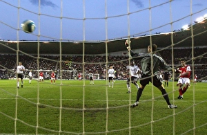 Robin van Persie shoots past Derby goalkeeper Roy Carroll to score the 2nd Arsenal goal Robin van Persie shoots past Derby goalkeeper Roy Carroll to score the 2nd Arsenal goal