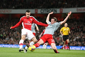 Robin van Persie shoots past Jamie Carragher to score Robin van Persie shoots past Jamie Carragher to score