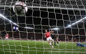 Robin van Persie shoots past Olypmiacos goalkeeper Robin van Persie shoots past Olypmiacos goalkeeper