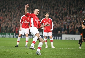 Robin van Persie shoots past Roma goalkeeper Doni to Robin van Persie shoots past Roma goalkeeper Doni to