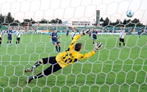 Robin van Persie shoots past Szombathelyi goalkeeoer Robin van Persie shoots past Szombathelyi goalkeeoer