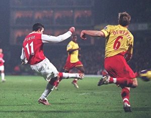 Robin van Persie shoots past Watford goalkeeper Ben Foster the score the 2nd Arsenal goal Robin van Persie shoots past Watford goalkeeper Ben Foster the score the 2nd Arsenal goal