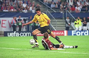 Robin van Persie is tripped by Hamburg goalkeeper Sasha Kirschstein for the Arsenal Robin van Persie is tripped by Hamburg goalkeeper Sasha Kirschstein for the Arsenal