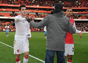 Suspended Emmanuel Eboue congratulates Cesc Fabregas and Gael Clichy after the match Suspended Emmanuel Eboue congratulates Cesc Fabregas and Gael Clichy after the match