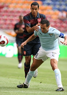 Theo Walcott (Arsenal) Luciano Zauri (Lazio) Theo Walcott (Arsenal) Luciano Zauri (Lazio)