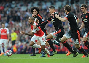 Theo Walcott (Arsenal) Marouane Fellaini, Chris Smalling and Daley Blind (Man Utd) Theo Walcott (Arsenal) Marouane Fellaini, Chris Smalling and Daley Blind (Man Utd)