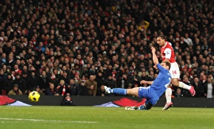 Theo Walcott scores Arsenal's 3rd goal under pressure from Branislav Ivanovic Theo Walcott scores Arsenal's 3rd goal under pressure from Branislav Ivanovic