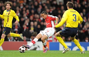 Theo Walcott shoots past Barcelona goalkeeper Victor Valdes to score the 1st Arsenal goal Theo Walcott shoots past Barcelona goalkeeper Victor Valdes to score the 1st Arsenal goal
