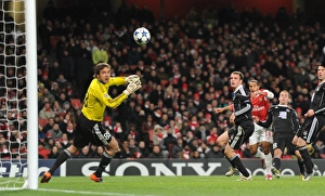 Theo Walcott shoots past Partizan goalkeeper Vladimir Stojkovic to score the 2nd Arsenal Theo Walcott shoots past Partizan goalkeeper Vladimir Stojkovic to score the 2nd Arsenal