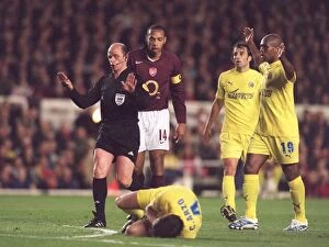 Images Dated 21st April 2006: Thierry Henry (Arsenal) looks on as Cesar Arzo (Villarreal) rolls on the floor