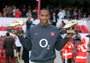 Thierry Henry (Arsenal)with his golden boot awards Thierry Henry (Arsenal)with his golden boot awards