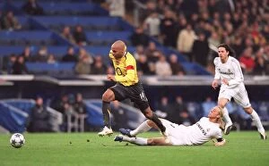 Images Dated 22nd February 2006: Thierry Henry beats Guti (Real) on his way to scoring Arsenals goal