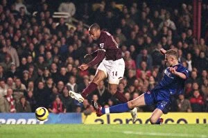 Images Dated 14th January 2006: Thierry Henry scores his 3rd goal Arsenals 6th under pressure from David Wheater