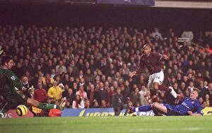 Images Dated 14th January 2006: Thierry Henry scores his 3rd goal Arsenals 6th under pressure from David Wheater