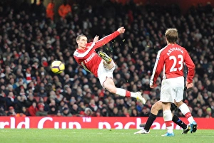 Thomas Vermaelen shoots past Man United goalkeeper Edwin van der Saar to score the Thomas Vermaelen shoots past Man United goalkeeper Edwin van der Saar to score the