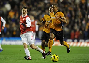 Tomas Rosicky (Arsenal) Karl Henry (Wolves). Wolverhampton Wanderers 0:2 Arsenal Tomas Rosicky (Arsenal) Karl Henry (Wolves). Wolverhampton Wanderers 0:2 Arsenal