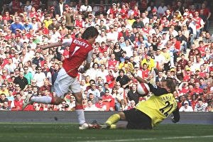 Tomas Rosicky shoots past Bolton goalkeeper Jussi Jaskelainen to score the first Arsenal Tomas Rosicky shoots past Bolton goalkeeper Jussi Jaskelainen to score the first Arsenal