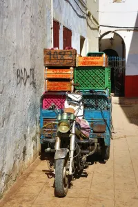 Street scene with a loaded motorcycle in the Medina of Rabat, Morocco Street scene with a loaded motorcycle in the Medina of Rabat, Morocco