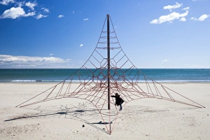 A child playing on a climbing frame in Peniscola, Spain A child playing on a climbing frame in Peniscola, Spain