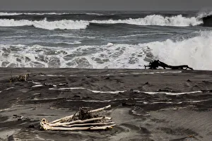 Logs washed up on the beach at Hokitika in West Coast, New Zealand Logs washed up on the beach at Hokitika in West Coast, New Zealand