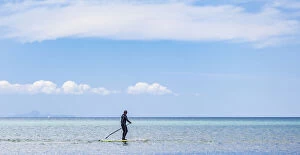 Auckland Gallery: A paddleboarder at Orewa in Auckland Region, New Zealand