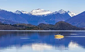 A speedboat crossing Lake Wanaka in Otago, New Zealand A speedboat crossing Lake Wanaka in Otago, New Zealand