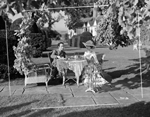 Edith, played by Valerie Hobson and Louis, played by Dennis Price take tea in the garden Edith, played by Valerie Hobson and Louis, played by Dennis Price take tea in the garden