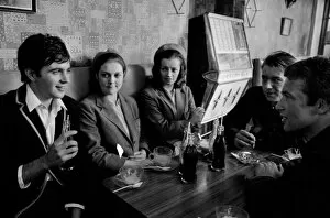 Jim Maclaine with a soft drink and friends