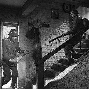 John Mills as Corporal Bins in close combat with a German Soldier John Mills as Corporal Bins in close combat with a German Soldier