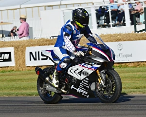 <b class=qtipBold><figcaption>CJ6 9090 Bruce Wilson, BMW HP4 Racer</figcaption></b><br>Bruce Wilson, BMW HP4 Racer, Goodwood Festival of Speed, 2017, Peaks of Performance, Motorsports Game Changers, automobiles, cars, entertainment, Festival of Speed, FoS, Goodwood, heritage, contemporary, modern, hill climb, July, June, motor sport, motorcars, nostalgia, racing, speed, sports, West Sussex., Moving Motor Show, motor bike racing, sports bikes, motor cycles, motorcycles, bikes, two wheels,<br><em>© 2017 Chris McEvoy, www.cjm-photography.co.uk, all rights reserved</em> CJ6 9090 Bruce Wilson, BMW HP4 Racer