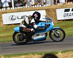 <b class=qtipBold><figcaption>CM20 0287 Alan Cathcart, Bianchi GP</figcaption></b><br>Alan Cathcart, Bianchi GP, Goodwood Festival of Speed, 2017, Peaks of Performance, Motorsports Game Changers, automobiles, cars, entertainment, Festival of Speed, FoS, Goodwood, heritage, contemporary, modern, hill climb, motor bike racing, sports bikes, motor cycles, motorcycles, bikes, two wheels, July, June, motor sport, motorcars, nostalgia, racing, speed, sports, West Sussex., Moving Motor Show,<br><em>© 2017 Chris McEvoy, www.cjm-photography.co.uk, all rights reserved</em> CM20 0287 Alan Cathcart, Bianchi GP
