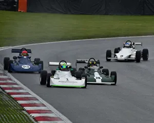 <b class=qtipBold><figcaption>CM25 9034 The leading group</figcaption></b><br>Paul Allen, Reynard SF79, Historic Formula Ford 2000, HSCC, Historic Race Meeting, Brands Hatch, September 2018, cars, Classic Racing Cars, Historic Racing, Historic Sports Car Club, autosport, motor racing, motor sport, nostalgia, racing cars, outdoors, racing, circuit racing, racing, speed, Indy circuit, single seaters, monoposto, rooster tail, wet race, rain, spray,<br><em>© 2018 Chris McEvoy, www.cjm-photography.co.uk, all rights reserved</em> CM25 9034 The leading group