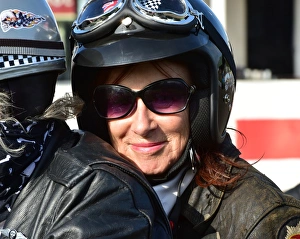 <b class=qtipBold><figcaption>CM4 9058 Lady biker</figcaption></b><br>Lady biker, Goodwood Revival 2014, Goodwood, Goodwood Revival 2014, Goodwood Transport Corps, lady biker, motorcycles, rockers.<br><em>© A© 2014 Chris McEvoy, all rights reserved, www.cjm-photography.co.uk.</em> CM4 9058 Lady biker