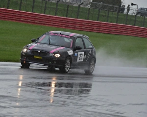 <b class=qtipBold><figcaption>CM5 7036 Maddy Maguire, MG ZR160</figcaption></b><br>Maddy Maguire, MG ZR160, BWRDC, Ladies Handicap race, Racing for a Record, Walter Hayes Trophy 2014, 2014, heavy rain, historic racing cars, Historic Sports Car Club, HSCC, motor racing, motor sport, Northamptonshire, racing, rain, rain spray, Silverstone, sports cars, Walter Hayes Trophy, Walter Hayes Trophy 2014, wet race, wet track<br><em>© A©2014 Chris McEvoy, all rights reserved, www.cjm-photography.co.uk</em> CM5 7036 Maddy Maguire, MG ZR160