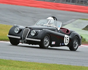 <b class=qtipBold><figcaption>CM9 5581 John Burton, Jaguar XK 120</figcaption></b><br>John Burton, Jaguar XK 120, MGC 7, RAC Woodcote Trophy, Silverstone Classic 2015, Chris McEvoy, circuit racing, cjm-photography, classic cars, Classic Racing Cars, historic cars, historic racing cars, Historic Sports Car Club, HSCC, motor racing, motorsport, Northamptonshire, nostalgia, Pre-'56 Sports cars, RAC Woodcote Trophy, retro, rocking and racing, Silverstone, Silverstone Classic, Silverstone Classic 2015, Sliverstone Classic, sports cars, classic cars, sports cars,<br><em>© ©2015 Chris McEvoy, all rights reserved, www.cjm-photography.co.uk</em> CM9 5581 John Burton, Jaguar XK 120