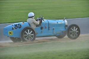 <b class=qtipBold><figcaption>Stephen Gentry, Bugatti T35B</figcaption></b><br>Stephen Gentry, Bugatti T35B, VSCC Seaman Trophy event at Snetterton. Taking a wide line and ointo the grass after Murrays.<br><em>© (C)2013 Chris McEvoy, all rights reserved</em> Stephen Gentry, Bugatti T35B