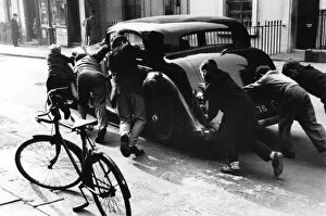 Boys pushing a car, Princedale Road, Kensington, London