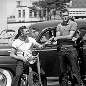 <b class=qtipBold><figcaption>Two 1950s Youths</figcaption></b><br>San Francisco, California: c. 1954 Two youths with a motorcycle.<br><em>© Underwood Archives/UIG</em> Two 1950s Youths