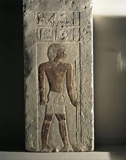 Ancient Egyptian limestone relief with figure of deceased holding sceptre and staff from Tomb of Iry, Old Kingdom, IV Dynasty