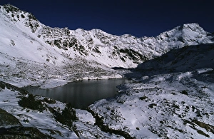Andorra, High valley of the Valira river, glacial lake and snowy summits Andorra, High valley of the Valira river, glacial lake and snowy summits