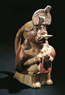 Anthropomorphic polychrome terracotta vessel in shape of priest holding sacrificial Anthropomorphic polychrome terracotta vessel in shape of priest holding sacrificial