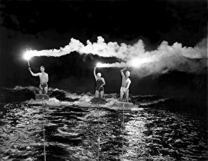 <b class=qtipBold><figcaption>Aquaplaning By Fiery Night</figcaption></b><br>Spring Lake Beach, New Jersey: June 7, 1938. 'Riders of the skidding planes' light up the sky as they ride their aquaplanes under the illumination of fiery torches.<br><em>© Underwood Archives/UIG</em> Aquaplaning By Fiery Night