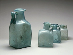 Four blue glass bottles, used as measures of capacity, from Pompei Four blue glass bottles, used as measures of capacity, from Pompei
