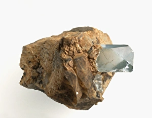 Blue topaz crystal in pegmatite groundmass Blue topaz crystal in pegmatite groundmass